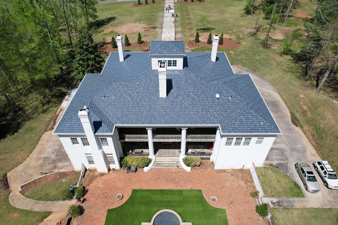 Coated steel slate-profile roofing installed on a residence