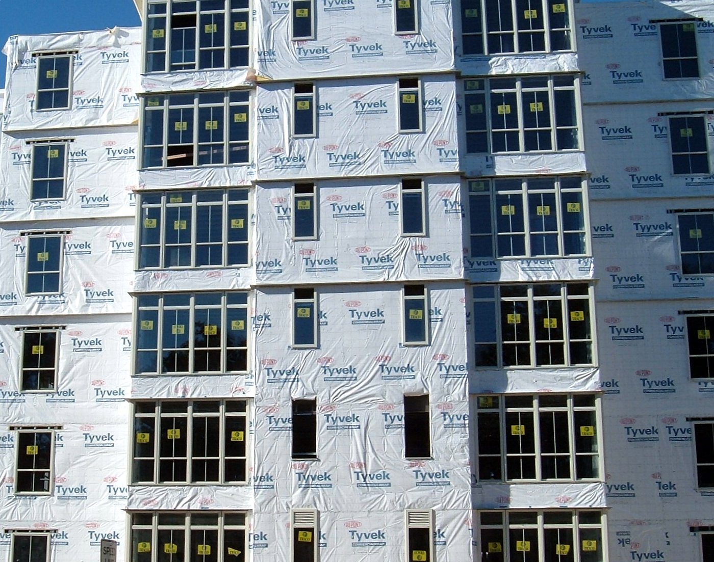 Housewrap installed across a multi-unit building under construction