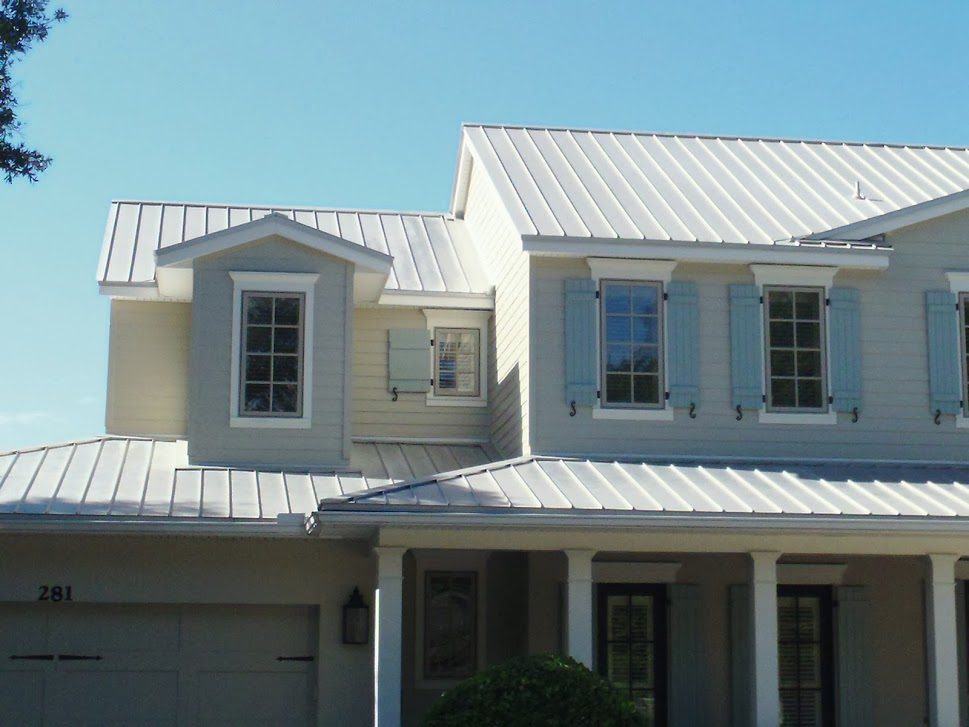 Standing seam metal roof with vertical panels joined at raised seams